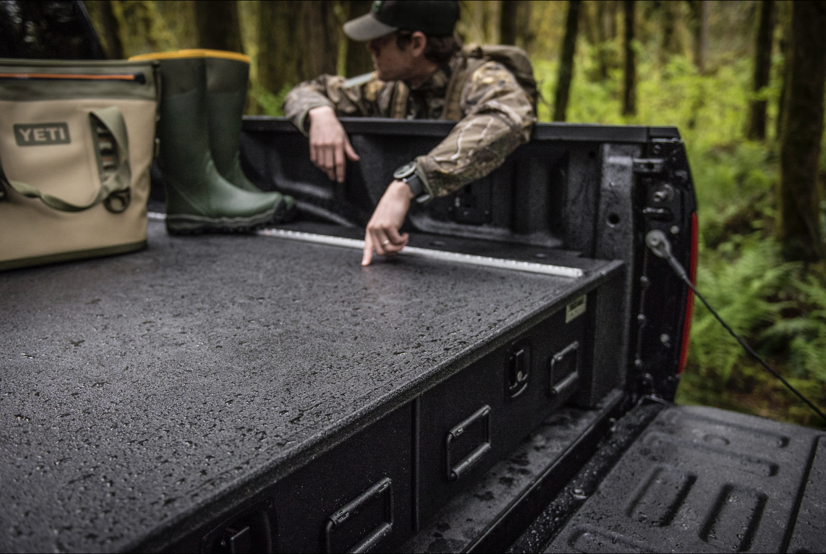 A black 2017 Ford F-150 with an all-weather TruckVault