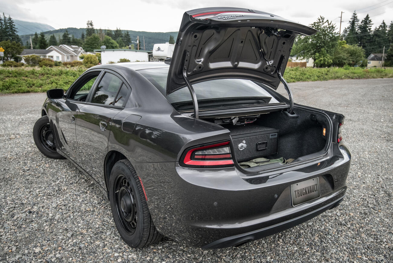 Sedan Baseline TruckVault secure vehicle storage inside Dodge Charger sedan with trunk open