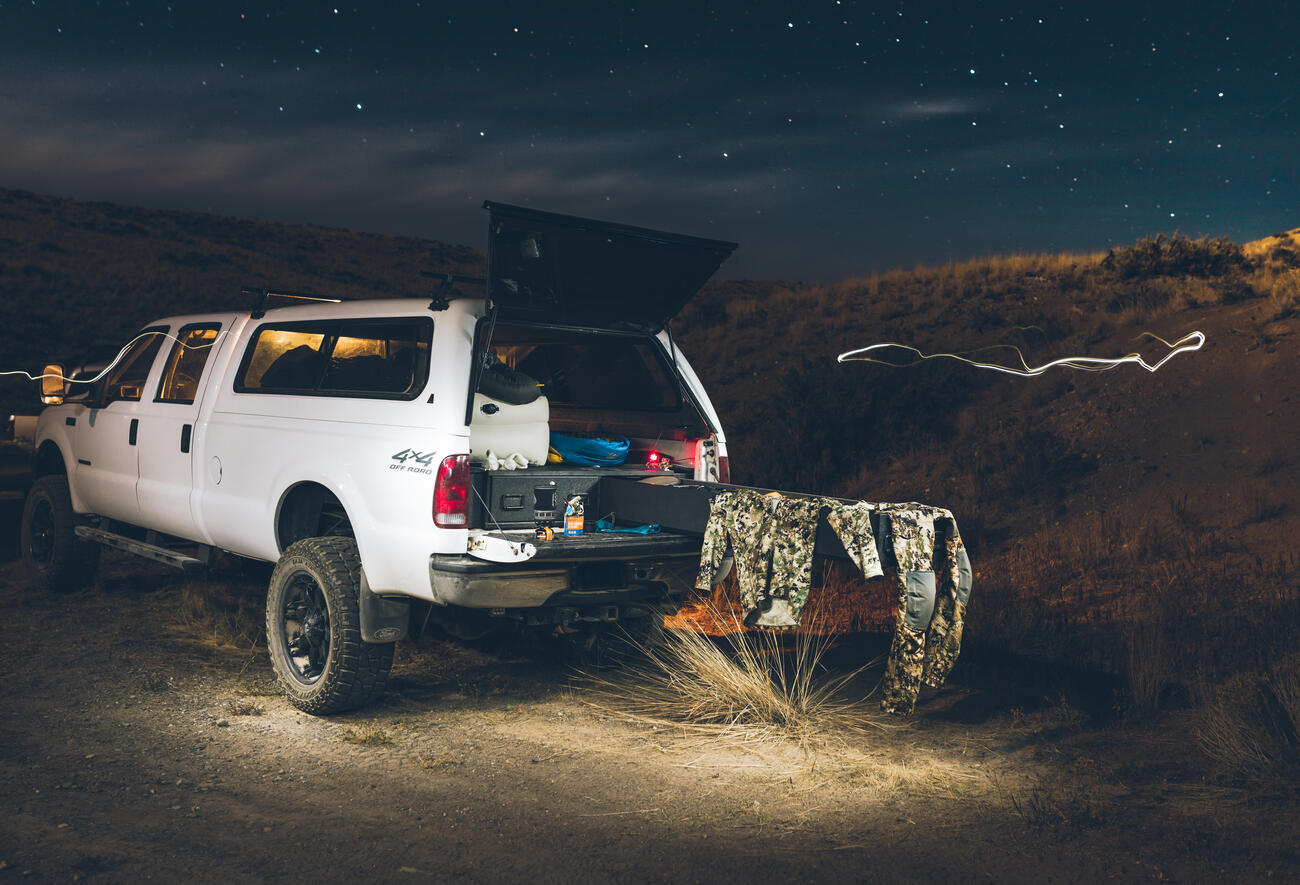 Hunter truck bed camping in Idaho