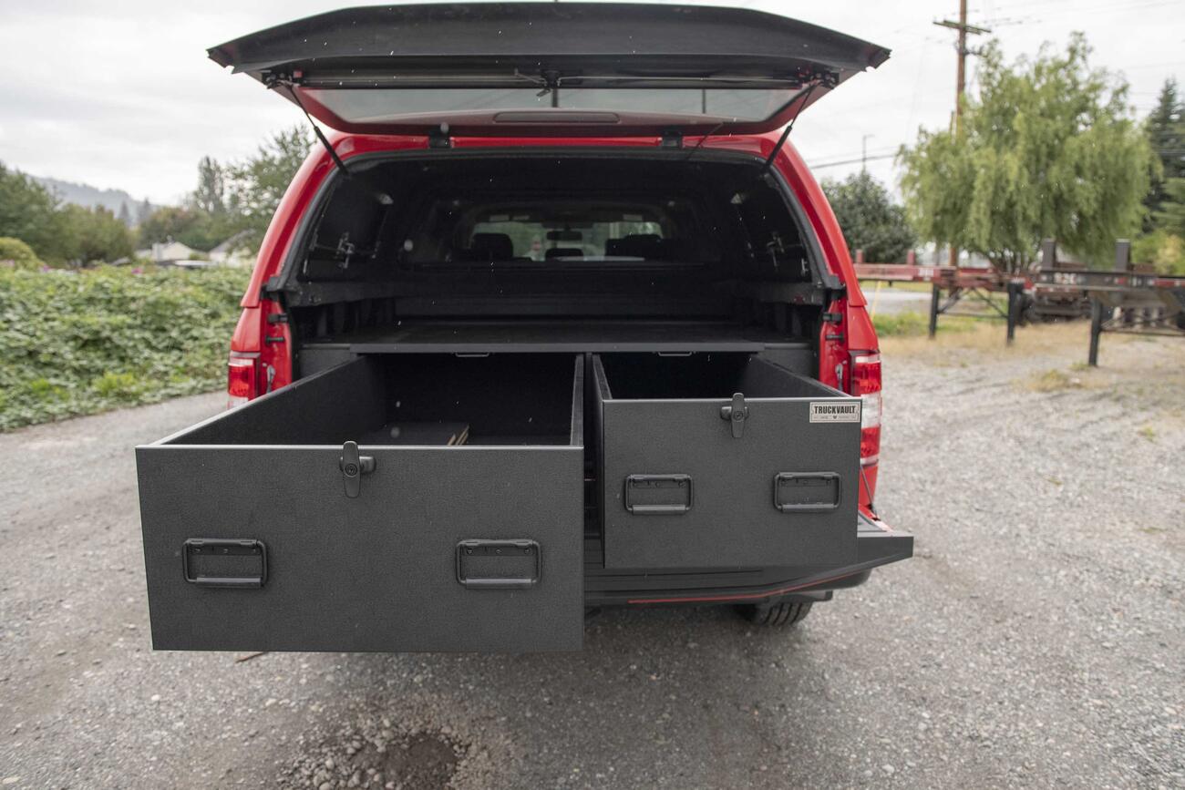 A Ford F250 used as a fire truck with TruckVault storage system in the truck bed.