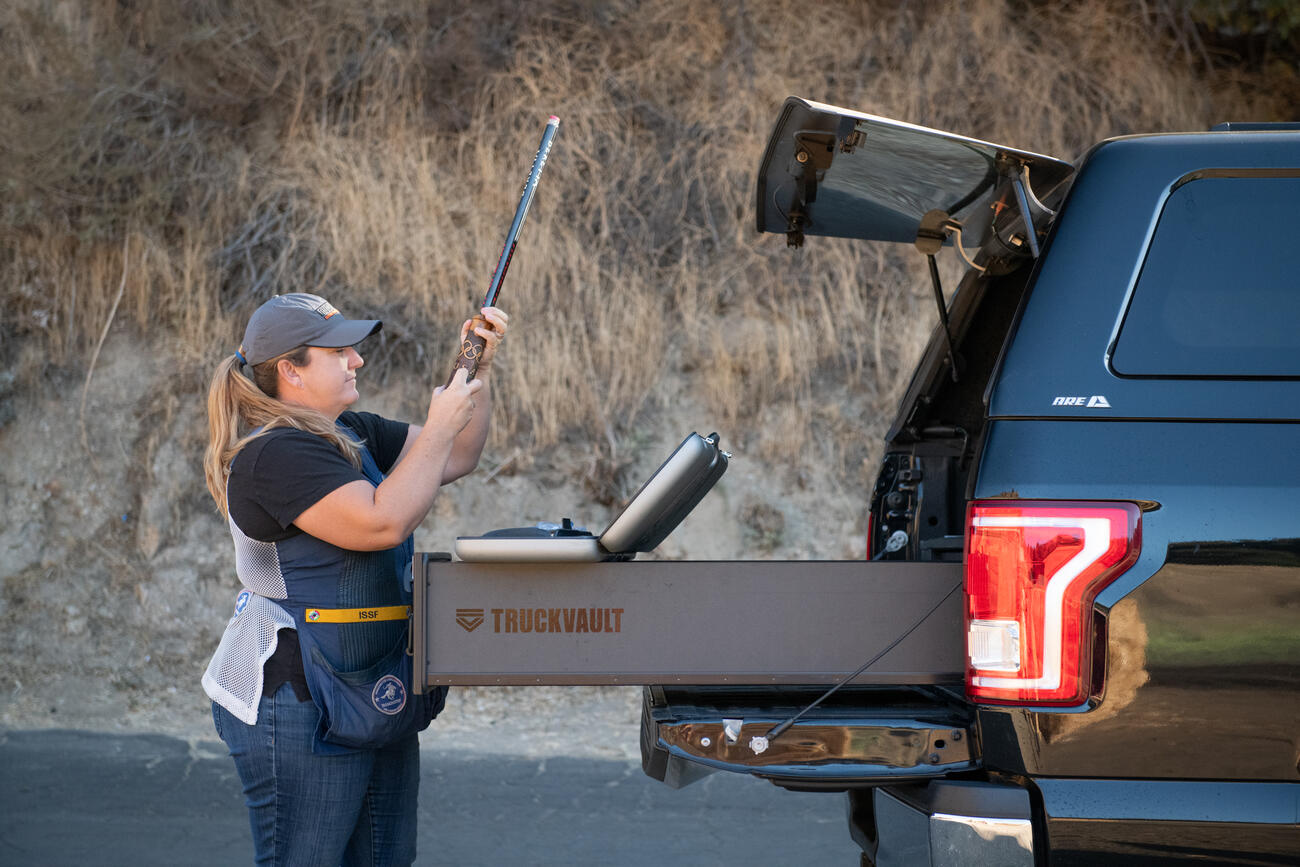 Olympian Kim Rhode loading her shotgun out of the back of a TruckVault.