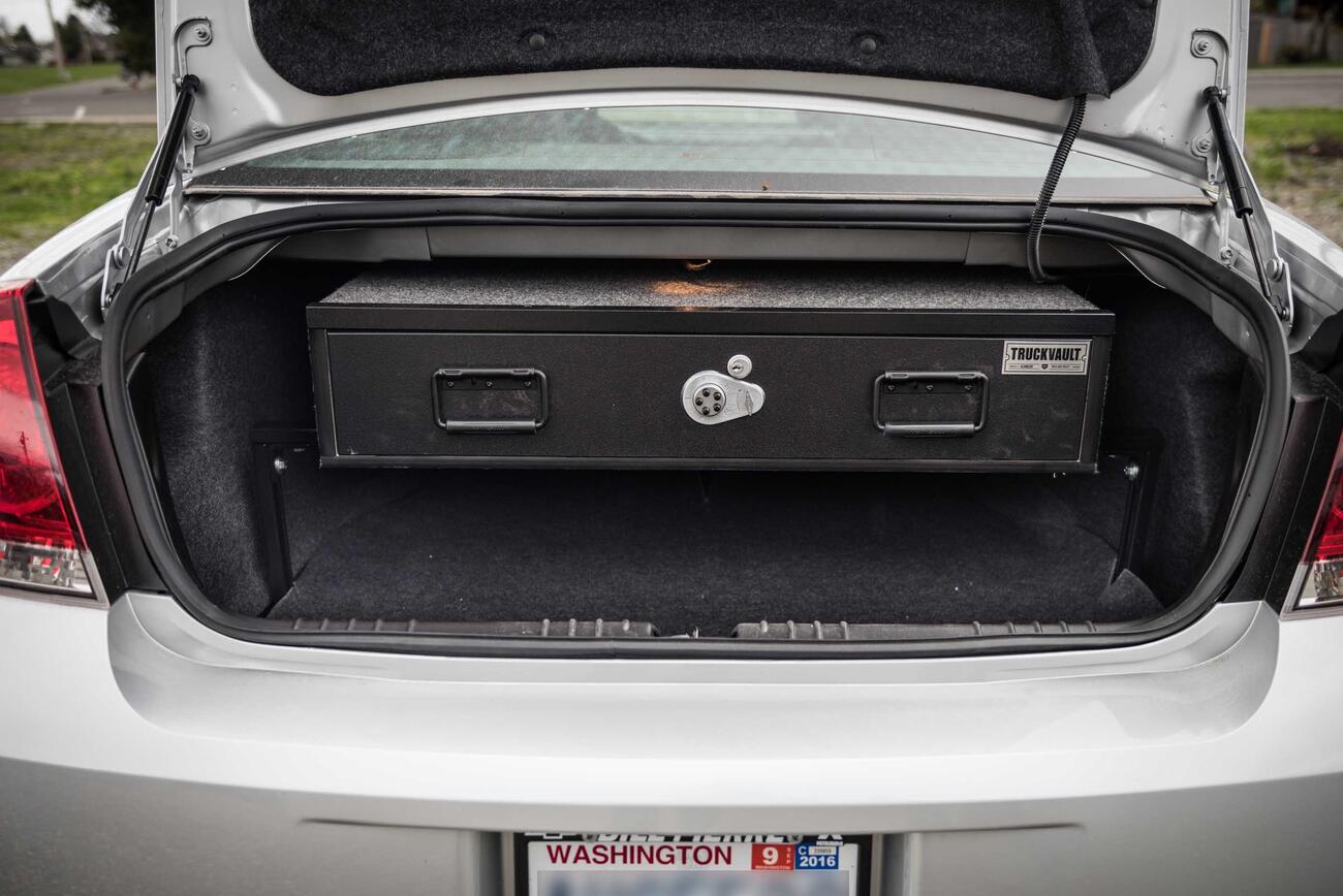 SedanSeries_ElevatedLine_1Drawer_2016_Chevy_Impala_Customer-Install-2.jpg A silver Chevy Impala with an Elevated TruckVault in the trunk space.