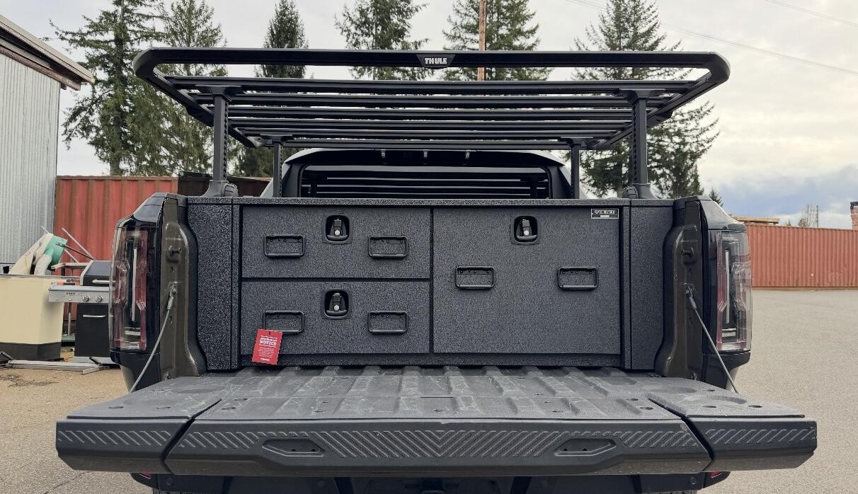 Custom All-Weather Field Ranger by TruckVault shown in the open bed of a Hummer Electric Vehicle