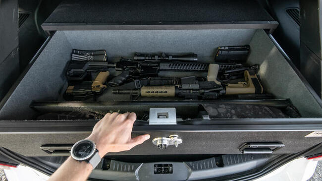 A TruckVault with various firearms in it.