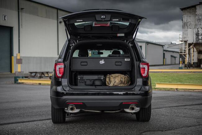 A Ford Explorer with an Elevated TruckVault in the trunk.