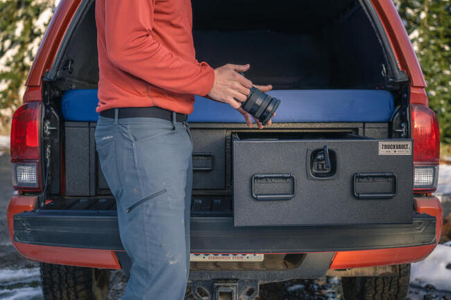 Scott Kranz pulling his camera out of his TruckVault system.