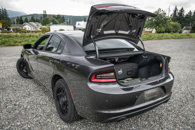 Dodge Charger sedan with trunk open featuring TruckVault Sedan Series Baseline Model