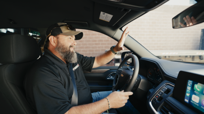 TruckVault Rep Mike Dopsovic driving and waving hello