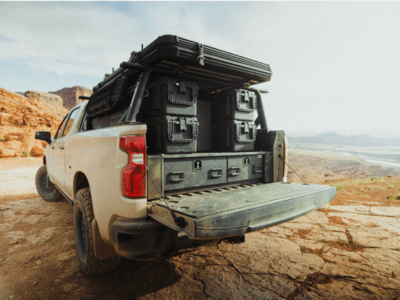 2023 Chevrolet Silverado 1500 All-Weather Offset TruckVault Drawers Rear Angled View with boxes stacked on top of the vault.