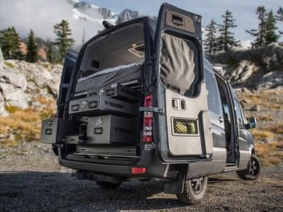 A TruckVault secure storage system in the back of a Mercedes Sprinter van.