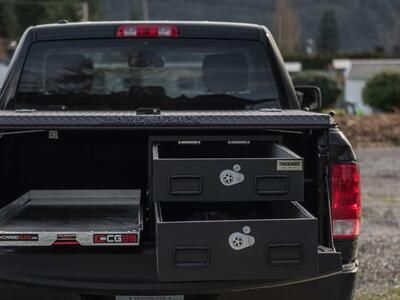 pickup truck with half width drawers stacked on passenger side and cargo glide on driver side