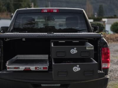 pickup truck with half width drawers stacked on passenger side and cargo glide on driver side