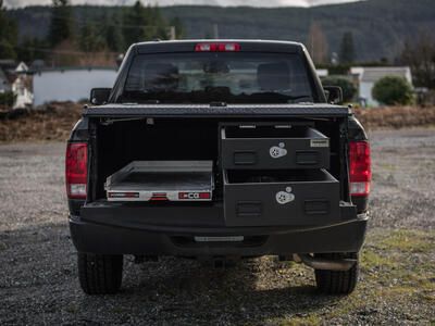 pickup truck with half width drawers stacked on passenger side and cargo glide on driver side