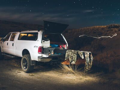 Hunter truck bed camping in Idaho