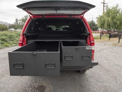 A Ford F250 used as a fire truck with TruckVault storage system in the truck bed.