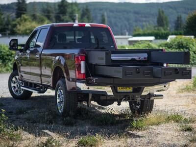 A Ford F250 with a custom 2 drawer TruckVault and a CargoGlide.