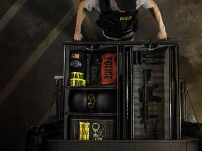 Police officer opening a TruckVault full of gear