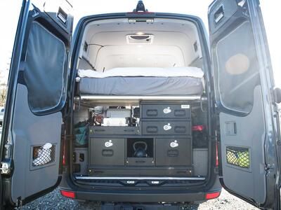 A TruckVault secure storage system in the back of a Mercedes Sprinter.