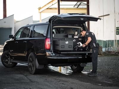 TruckVault SUV Storage Chevy Tahoe with Drone Responder Line installed in rear of the SUV