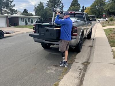 Dodge Ram Magnum 2 Drawer All Weather TruckVault In Use with Man Pulling Ladder from Drawer