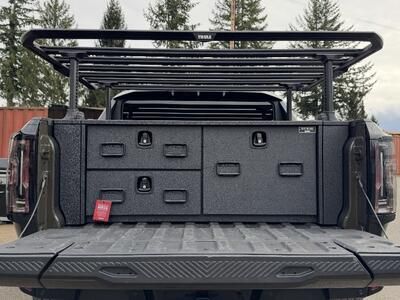Custom All-Weather Field Ranger by TruckVault shown in the open bed of a Hummer Electric Vehicle