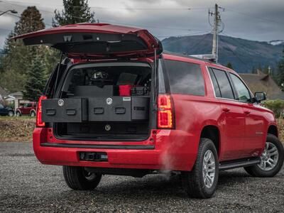 The back of an open fire department, Red Chevy Suburban with a custom TruckVault