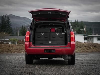 The back of an red, open fire department Chevy Suburban with a custom TruckVault.