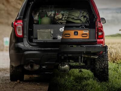 Two photos spliced together. One of a soldier and his TruckVault and one of a hunter and his TruckVault.